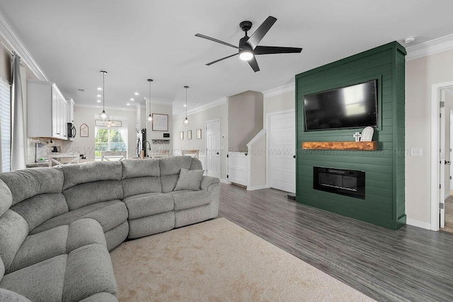 474 Meadow Way, Jasper, AL 35501 - living room featuring dark wood-style floors, ornamental molding, a fireplace, ceiling fan, and recessed lighting