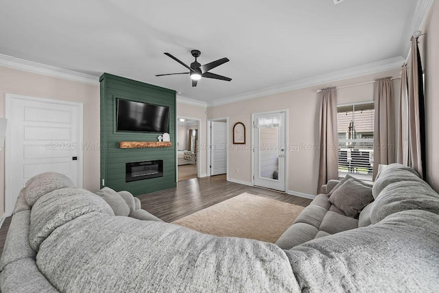 474 Meadow Way, Jasper, AL 35501 - living area featuring crown molding, wood finished floors, a large fireplace, and ceiling fan