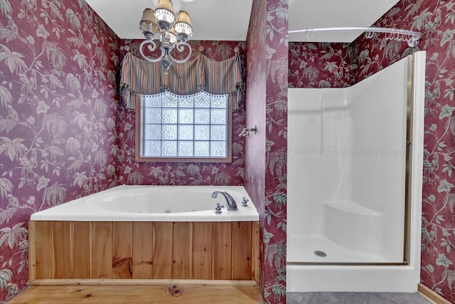 5305 Split Rail Dr, Jasper, AL 35503 - full bathroom featuring wallpapered walls, a shower stall, a chandelier, and a tub with jets