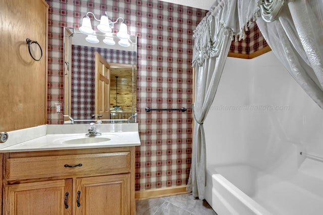 5305 Split Rail Dr, Jasper, AL 35503 - full bathroom featuring wallpapered walls, vanity, shower / tub combo with curtain, and tile patterned floors