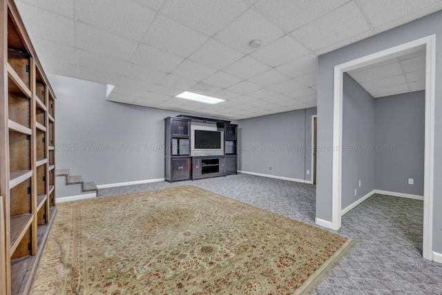 5305 Split Rail Dr, Jasper, AL 35503 - unfurnished living room featuring carpet, a drop ceiling, and stairs
