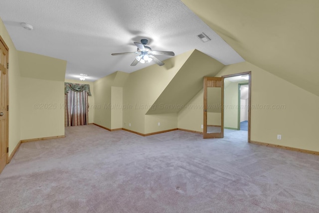 5305 Split Rail Dr, Jasper, AL 35503 - bonus room featuring ceiling fan, carpet floors, lofted ceiling, and a textured ceiling