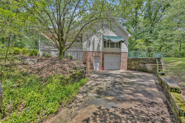 5305 Split Rail Dr, Jasper, AL 35503 - view of front facade featuring driveway, brick siding, and an attached garage