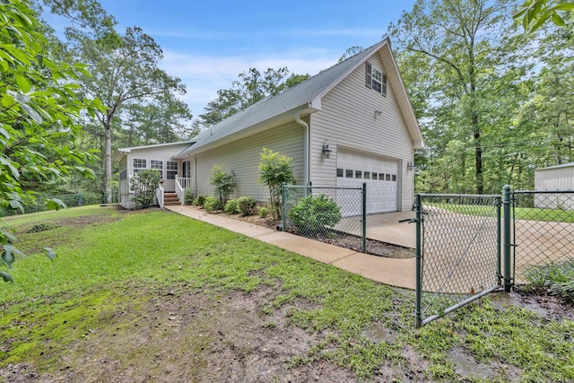 5305 Split Rail Dr, Jasper, AL 35503 - view of side of home with a gate, a garage, and concrete driveway
