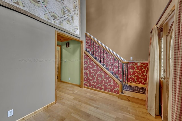 5305 Split Rail Dr, Jasper, AL 35503 - staircase with wood finished floors and wallpapered walls