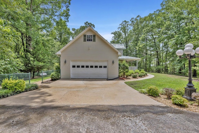 5305 Split Rail Dr, Jasper, AL 35503 - view of side of property featuring a garage, driveway, and a metal roof