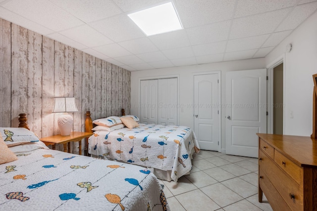 436 Ducktail Rd, Houston, AL 35572 - bedroom featuring a drop ceiling, light tile patterned floors, and wood walls