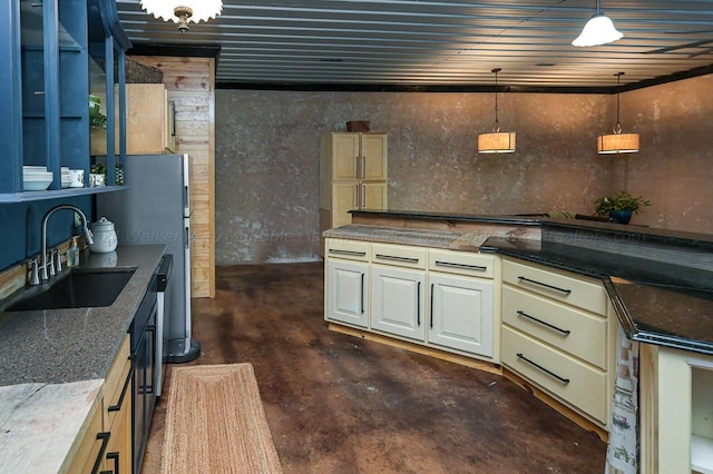 178 Turtle Ln, Houston, AL 35572 - kitchen with a sink, decorative light fixtures, concrete floors, and dark stone counters