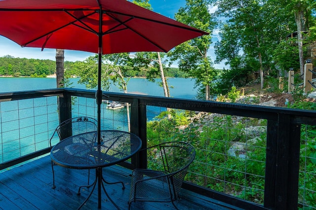 178 Turtle Ln, Houston, AL 35572 - wooden terrace featuring a water view, outdoor dining space, and view of scattered trees