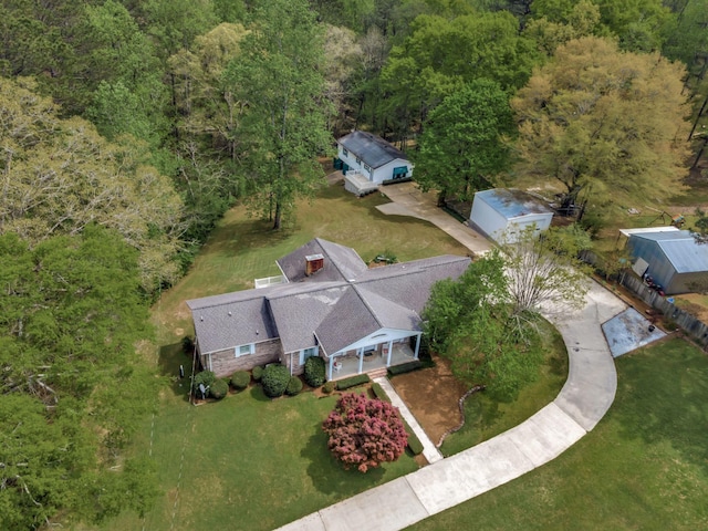 drone / aerial view featuring a view of trees