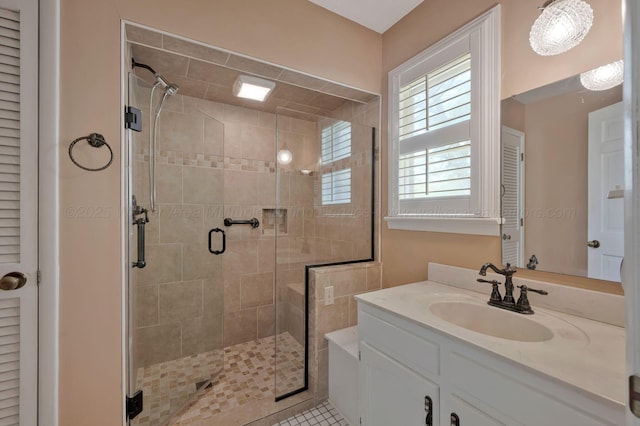 full bathroom featuring vanity and a stall shower