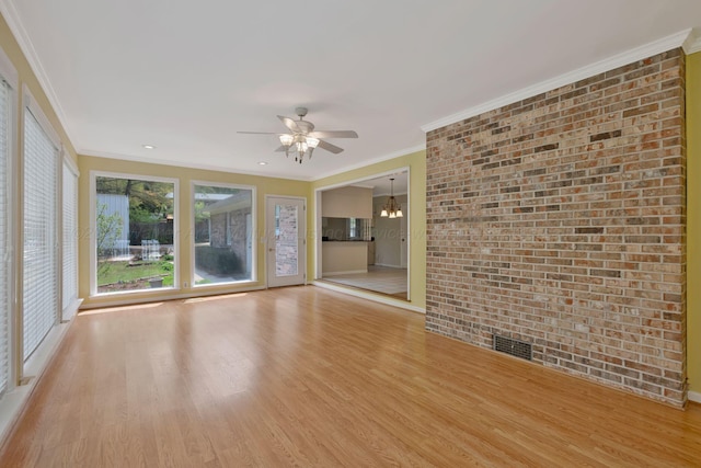 unfurnished room with light wood finished floors, visible vents, ornamental molding, and ceiling fan with notable chandelier