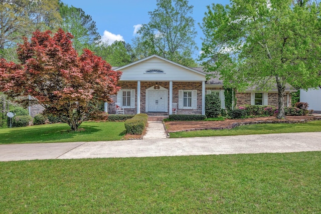 neoclassical / greek revival house featuring a porch and a front yard