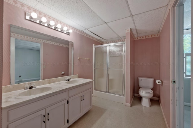 full bath featuring a shower stall, toilet, and a sink