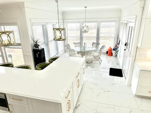 4963 Littleville Rd, Haleyville, AL 35565 - kitchen featuring light marble finish flooring, crown molding, light countertops, white cabinets, and french doors