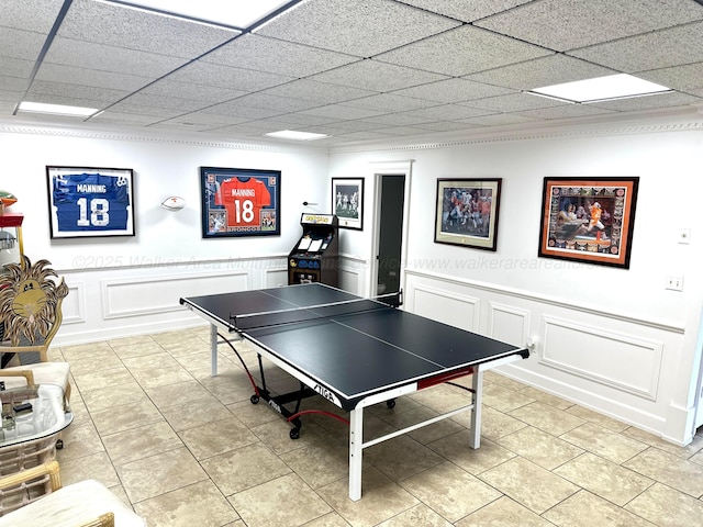 4963 Littleville Rd, Haleyville, AL 35565 - playroom featuring a decorative wall, wainscoting, and light tile patterned floors