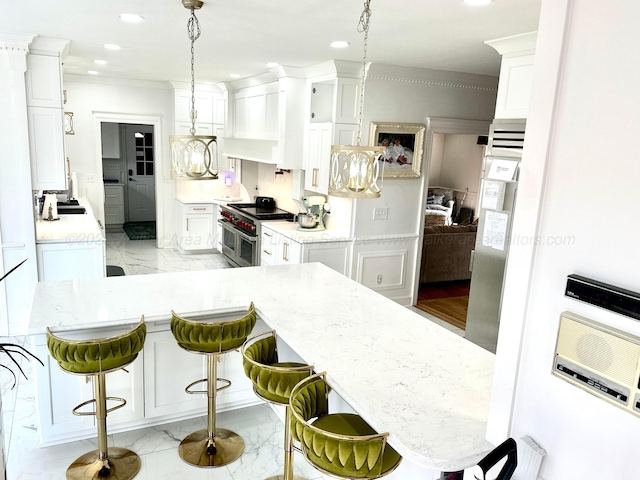 4963 Littleville Rd, Haleyville, AL 35565 - kitchen featuring range with two ovens, light marble finish flooring, white cabinetry, recessed lighting, and a breakfast bar