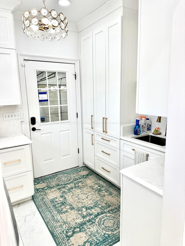 4963 Littleville Rd, Haleyville, AL 35565 - entryway featuring a chandelier and marble look tile flooring