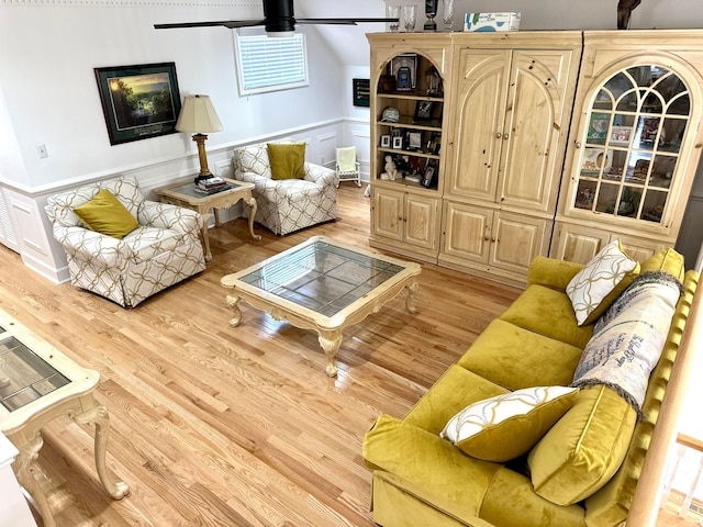 4963 Littleville Rd, Haleyville, AL 35565 - living area with wood finished floors, wainscoting, and a decorative wall