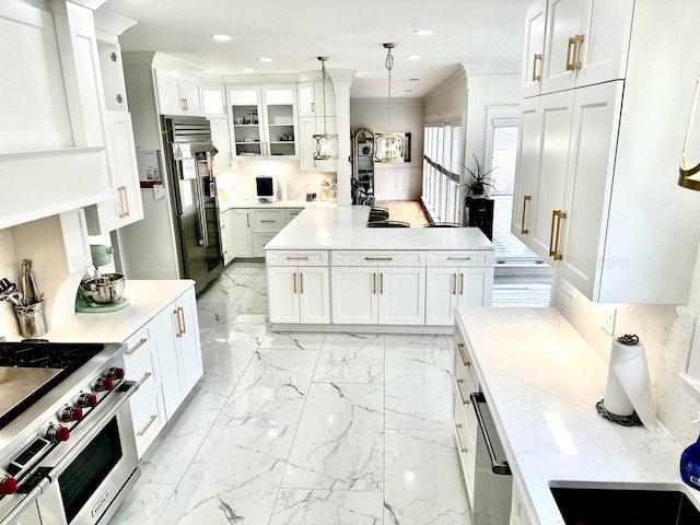 4963 Littleville Rd, Haleyville, AL 35565 - kitchen featuring premium appliances, crown molding, white cabinets, recessed lighting, and hanging light fixtures