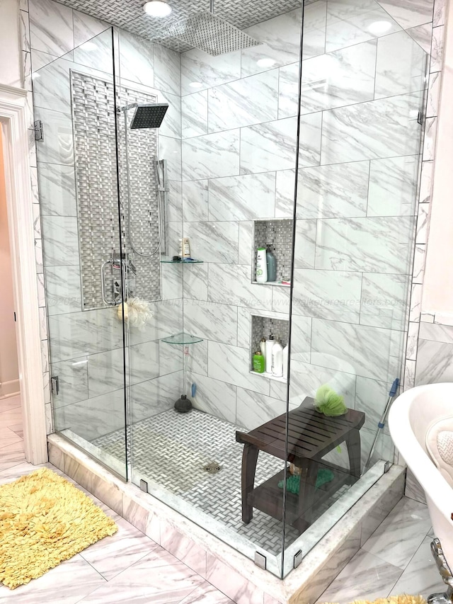 4963 Littleville Rd, Haleyville, AL 35565 - full bath with marble look tile flooring, a stall shower, and a freestanding tub