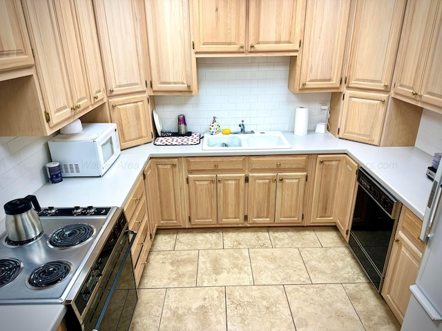 4963 Littleville Rd, Haleyville, AL 35565 - kitchen with white microwave, black dishwasher, electric range oven, and light countertops