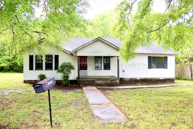 single story home featuring a porch, crawl space, and a front lawn