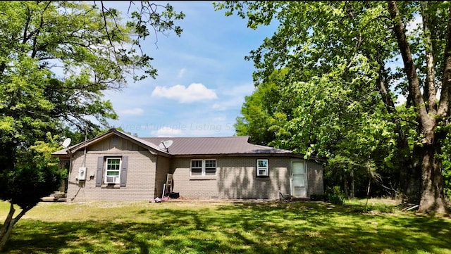1670 County Highway 47, Winfield, AL 35594 - back of house featuring cooling unit, brick siding, crawl space, and a yard