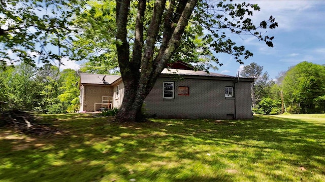 1670 County Highway 47, Winfield, AL 35594 - view of home's exterior with brick siding and a yard