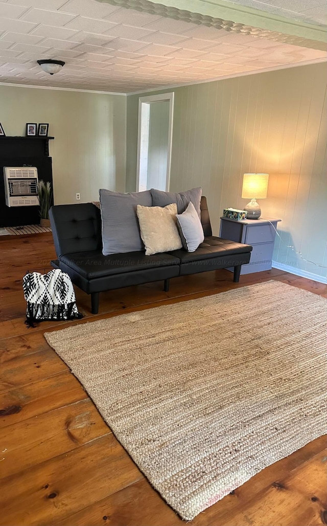 1670 County Highway 47, Winfield, AL 35594 - living room with heating unit and wood finished floors