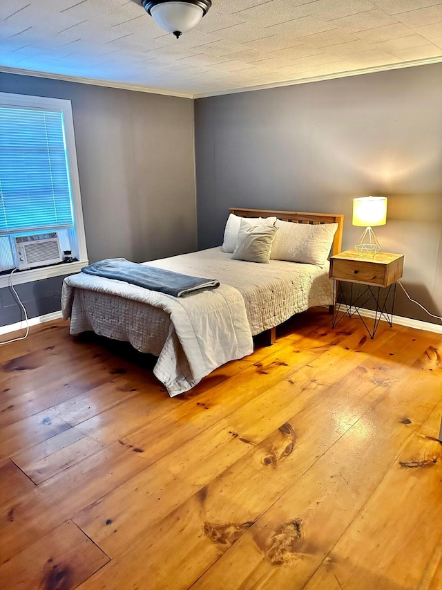 1670 County Highway 47, Winfield, AL 35594 - bedroom featuring hardwood / wood-style floors, ornamental molding, baseboards, and cooling unit