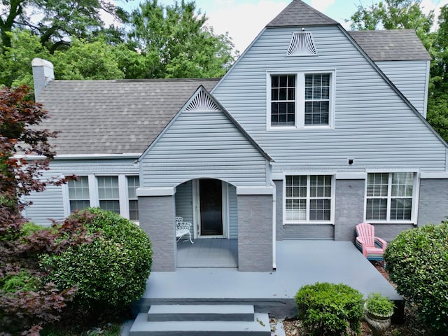 view of front of property with a shingled roof