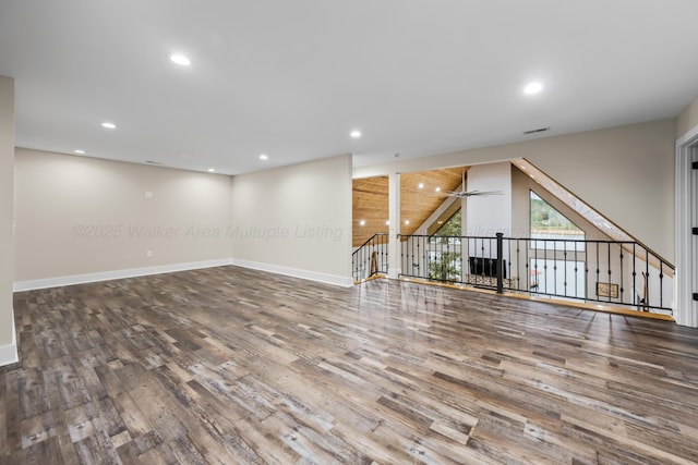 spare room featuring wood-type flooring and ceiling fan