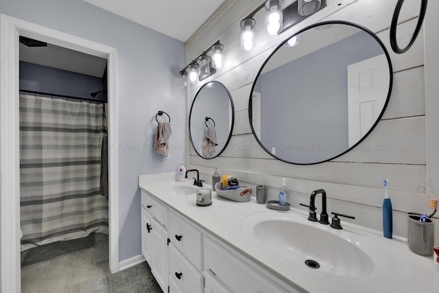 full bath featuring double vanity and a sink