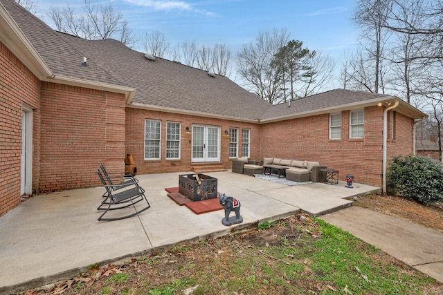 view of patio / terrace with an outdoor living space with a fire pit