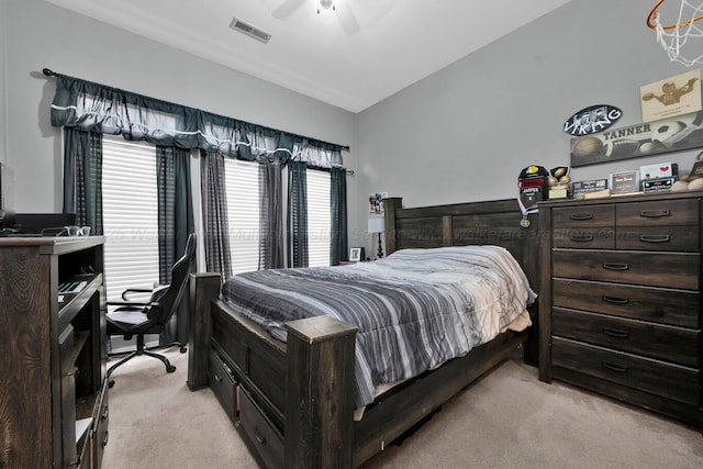 bedroom featuring ceiling fan, visible vents, and light carpet