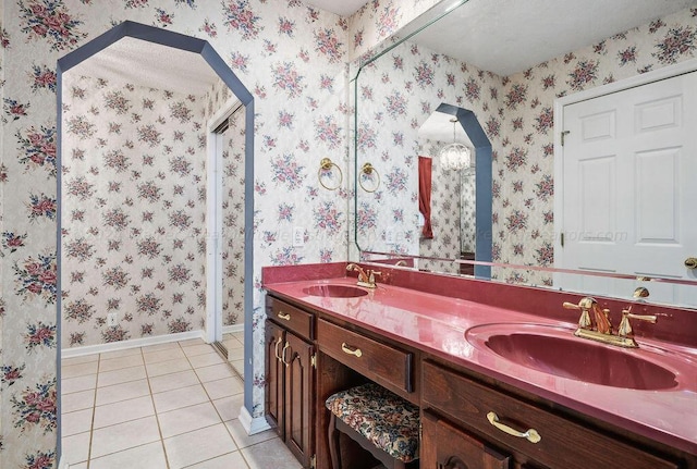 bathroom with tile patterned floors and vanity