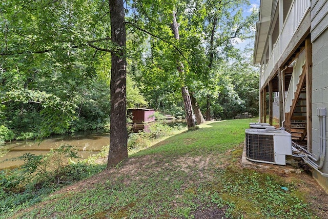 view of yard featuring central air condition unit