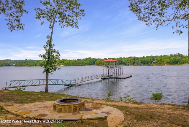 dock area featuring a water view and a fire pit