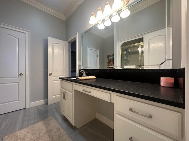 bathroom with vanity, a shower with shower door, and ornamental molding