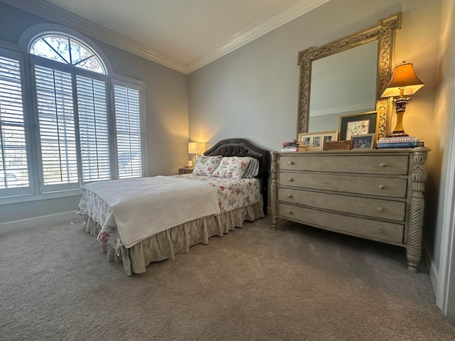 bedroom with ornamental molding and carpet