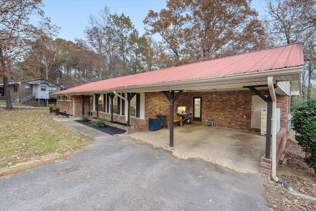 ranch-style house with a carport