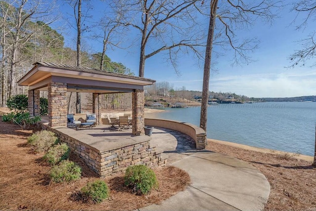 exterior space featuring a gazebo and a water view