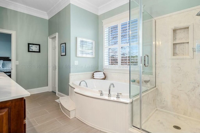 bathroom featuring wood tiled floor, a stall shower, a garden tub, and ornamental molding