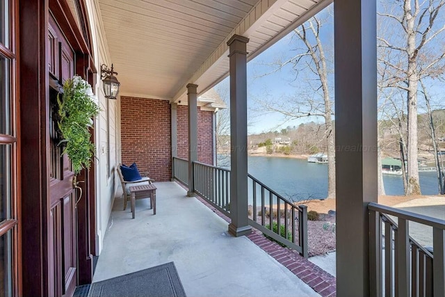 balcony featuring a water view