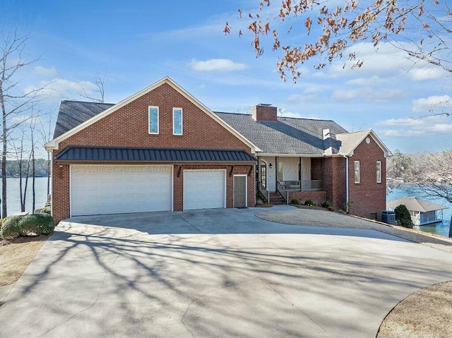 view of front of home featuring brick siding, covered porch, an attached garage, and concrete driveway