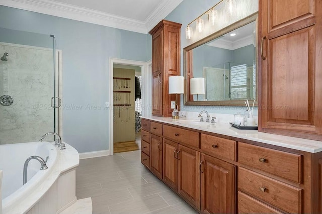 bathroom featuring a stall shower, vanity, a garden tub, and ornamental molding