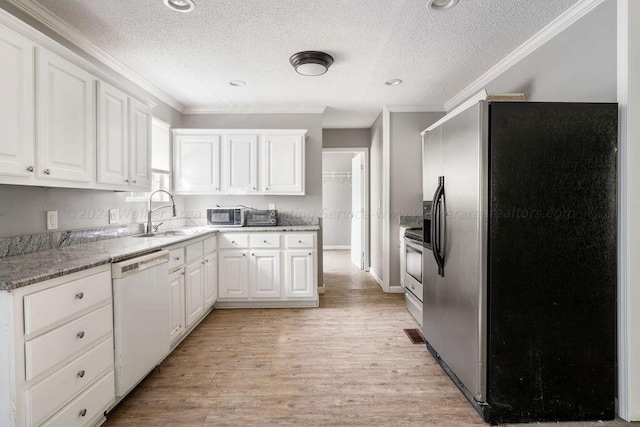 kitchen featuring white cabinetry, stainless steel appliances, and ornamental molding