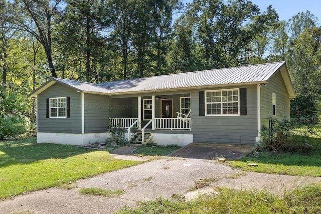 ranch-style home with a front yard and a porch