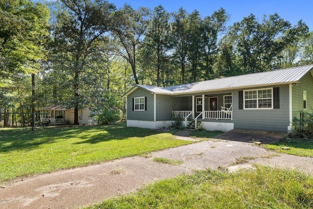 single story home with a porch and a front lawn